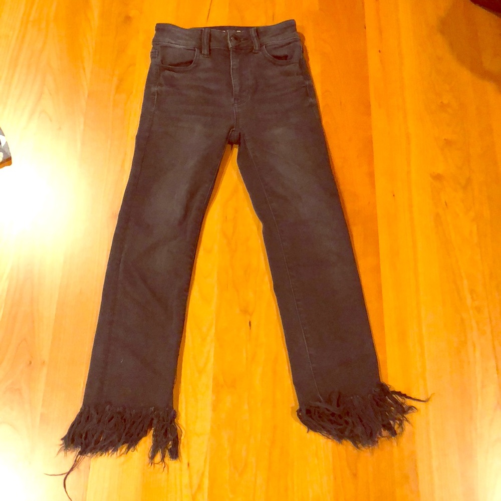 Black jeans with fringe bottom